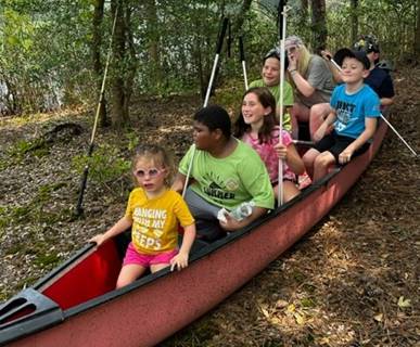 NFB BELL Academy students in Southern Maryland sit in a canoe