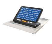 Photograph shows a Tablet enlarging newspaper text for accessible digital reading  that is resting on a folded newspaper, displaying blue text about freshwater and wetland ecosystems facing climate-change impacts.